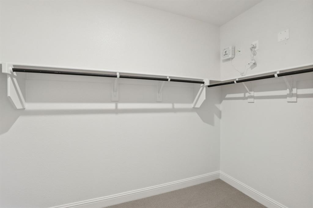 2206 Windy Trail Princeton, TX 75407 - Photo 32 of 34 a view of small space with racks on the wall