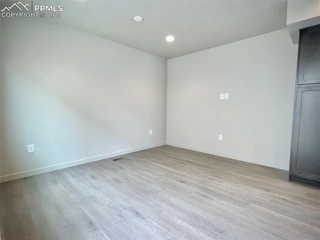 a kitchen with a sink a stove and a window