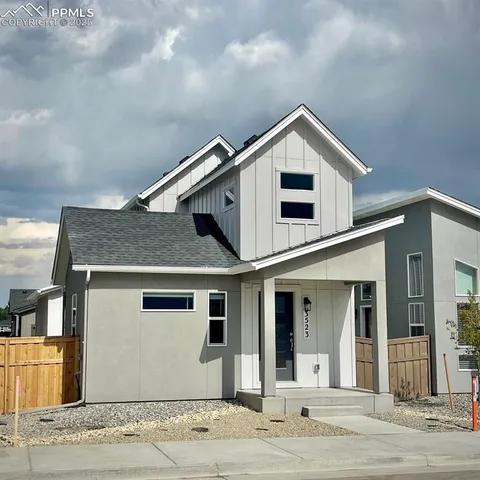 a front view of a house with yard