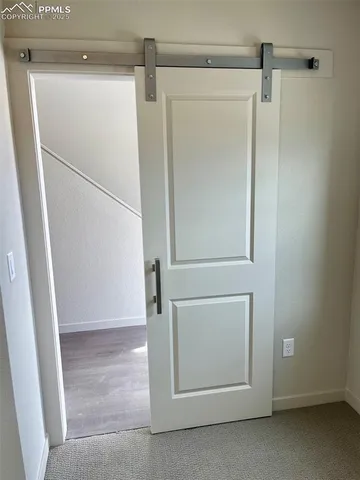an empty room with closet area