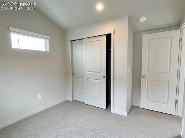 a kitchen with cabinets and stainless steel appliances