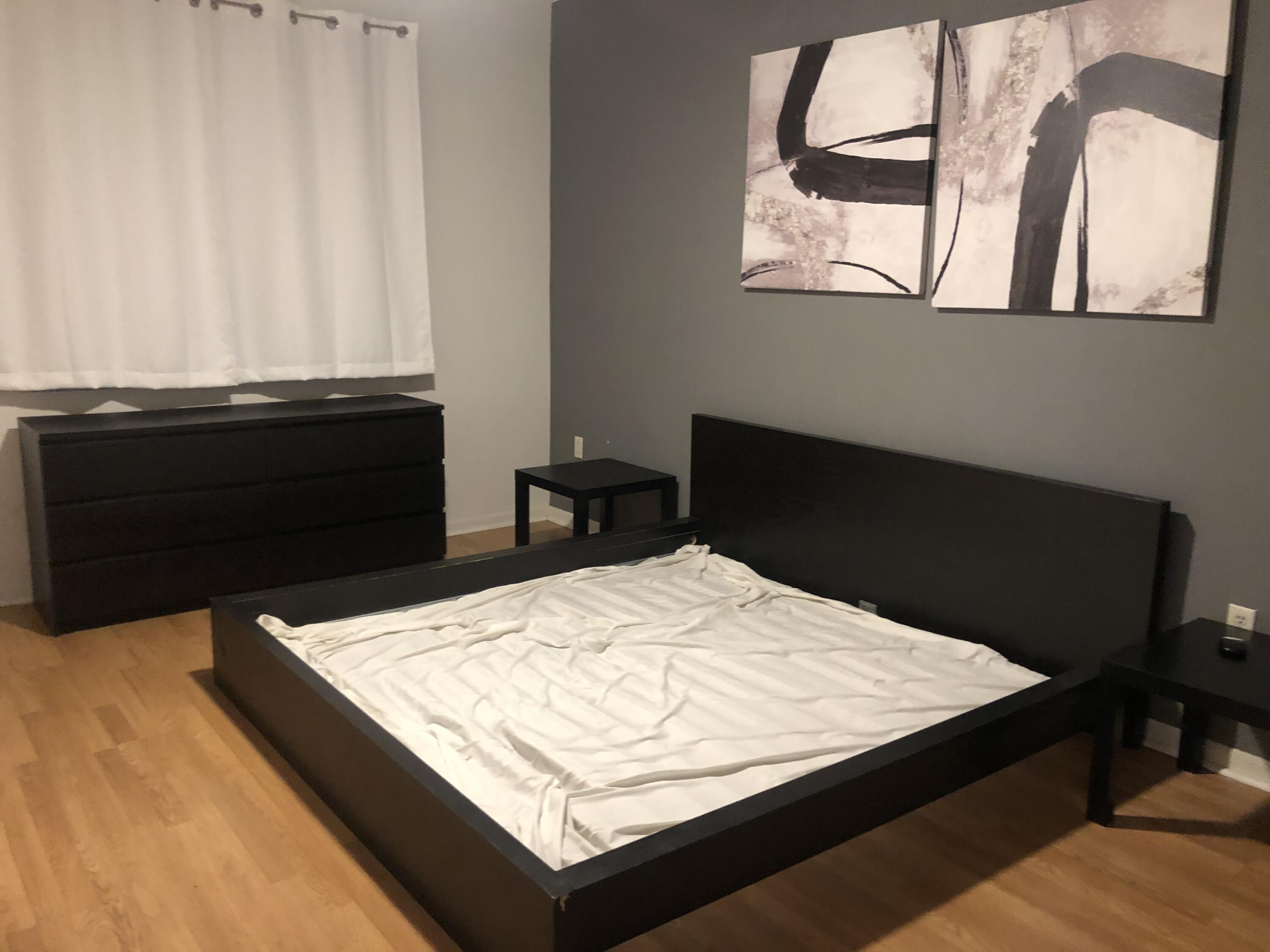 6936 Southwest 39th Street, Unit 304D Davie, FL 33314 - Photo 13 of 25 a bed sitting in a bedroom next to a window