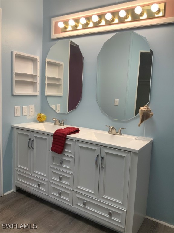 15550 Burnt Store Road, Unit 101 Punta Gorda, FL 33955 - Photo 13 of 28 a bathroom with a sink and a mirror