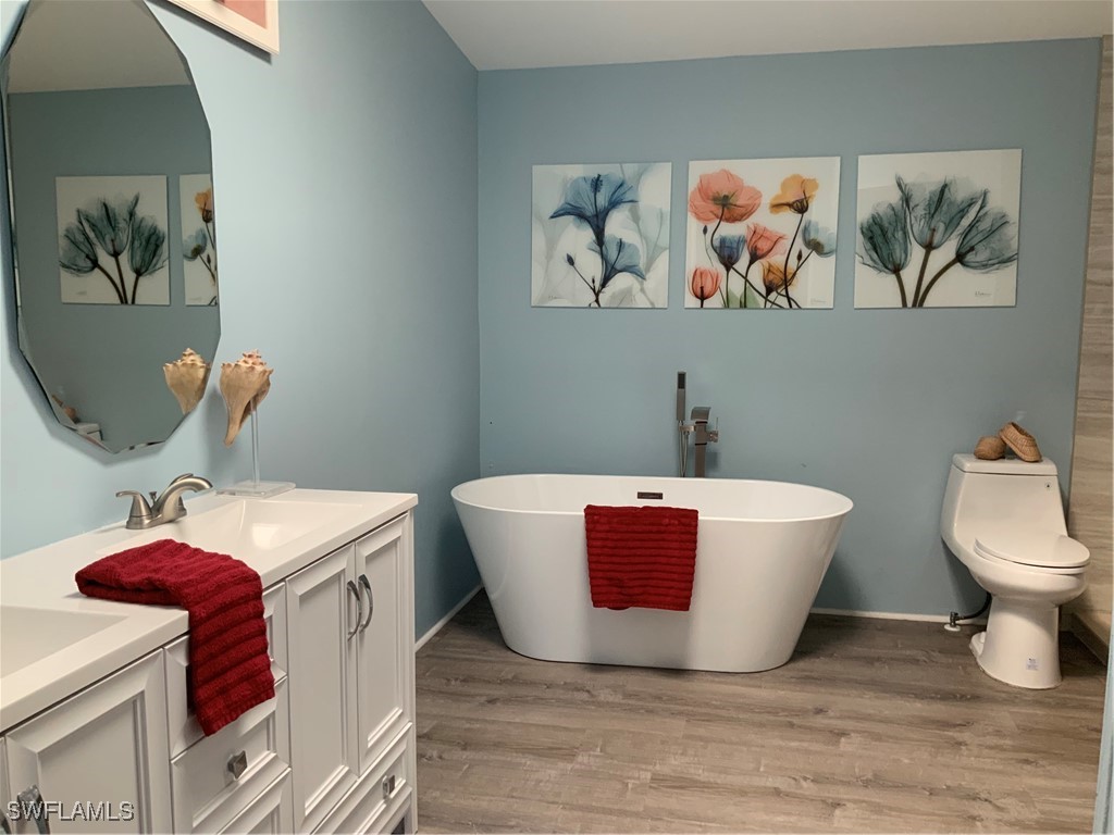 15550 Burnt Store Road, Unit 101 Punta Gorda, FL 33955 - Photo 14 of 28 a bathroom with a sink and a mirror