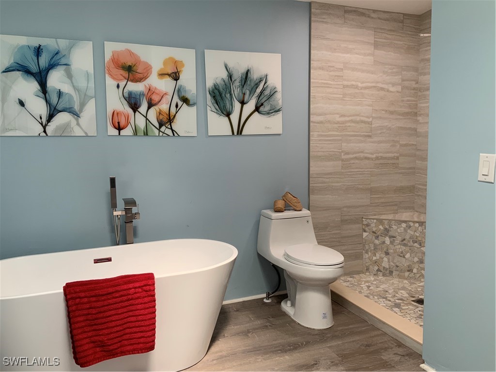 15550 Burnt Store Road, Unit 101 Punta Gorda, FL 33955 - Photo 15 of 28 a bathroom with a toilet and a sink