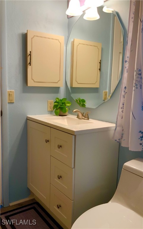15550 Burnt Store Road, Unit 101 Punta Gorda, FL 33955 - Photo 20 of 28 a bathroom with a sink vanity and a mirror