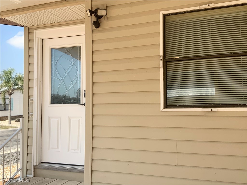 15550 Burnt Store Road, Unit 101 Punta Gorda, FL 33955 - Photo 3 of 28 a view of front door of house