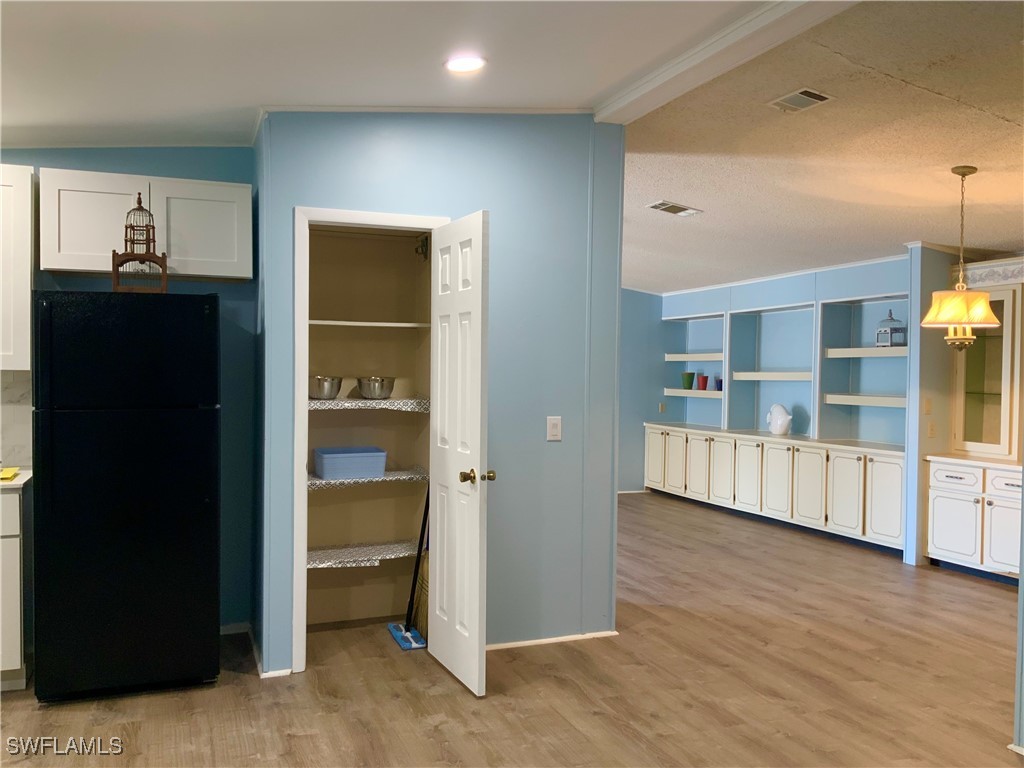 15550 Burnt Store Road, Unit 101 Punta Gorda, FL 33955 - Photo 8 of 28 a view of an empty room with kitchen and window