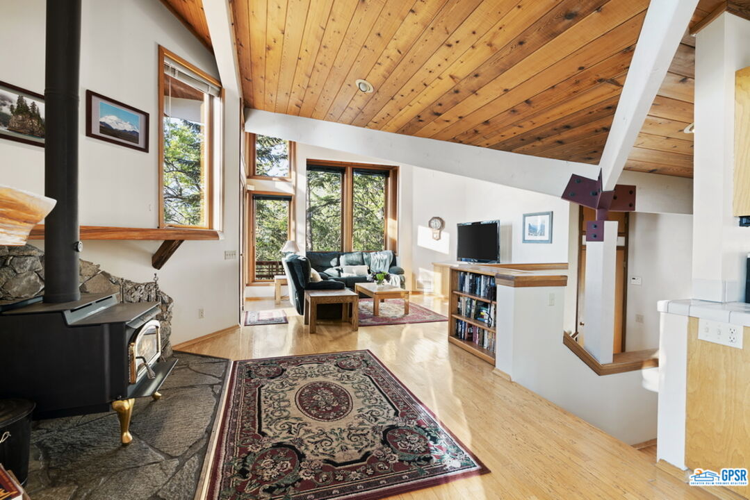 53085 Cedar Crest Drive Idyllwild, CA 92549 - Photo 19 of 55 a living room with furniture and a fireplace