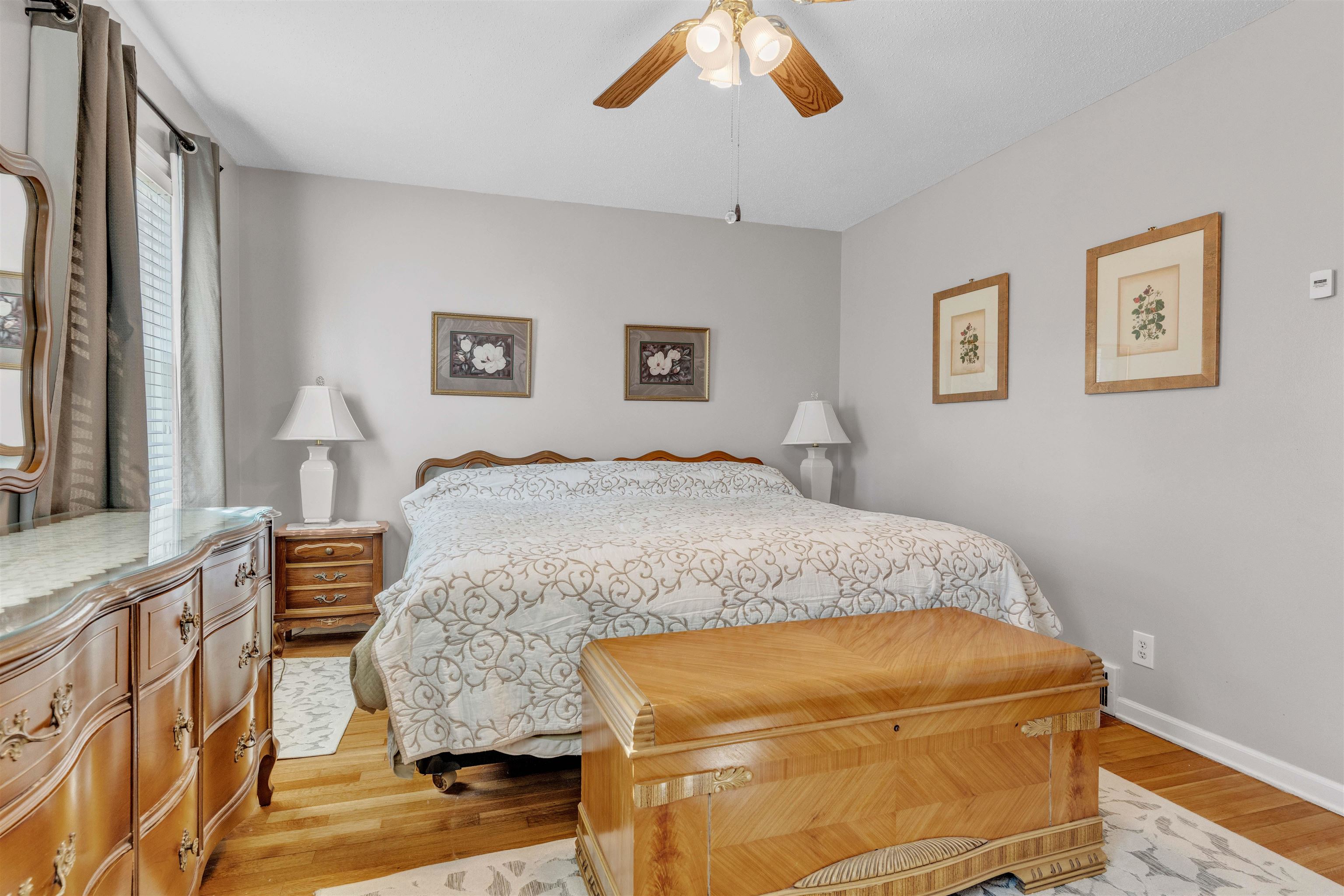 3613 Acacia Street Memphis, TN 38116 - Photo 14 of 33 a bedroom with a bed and a chandelier