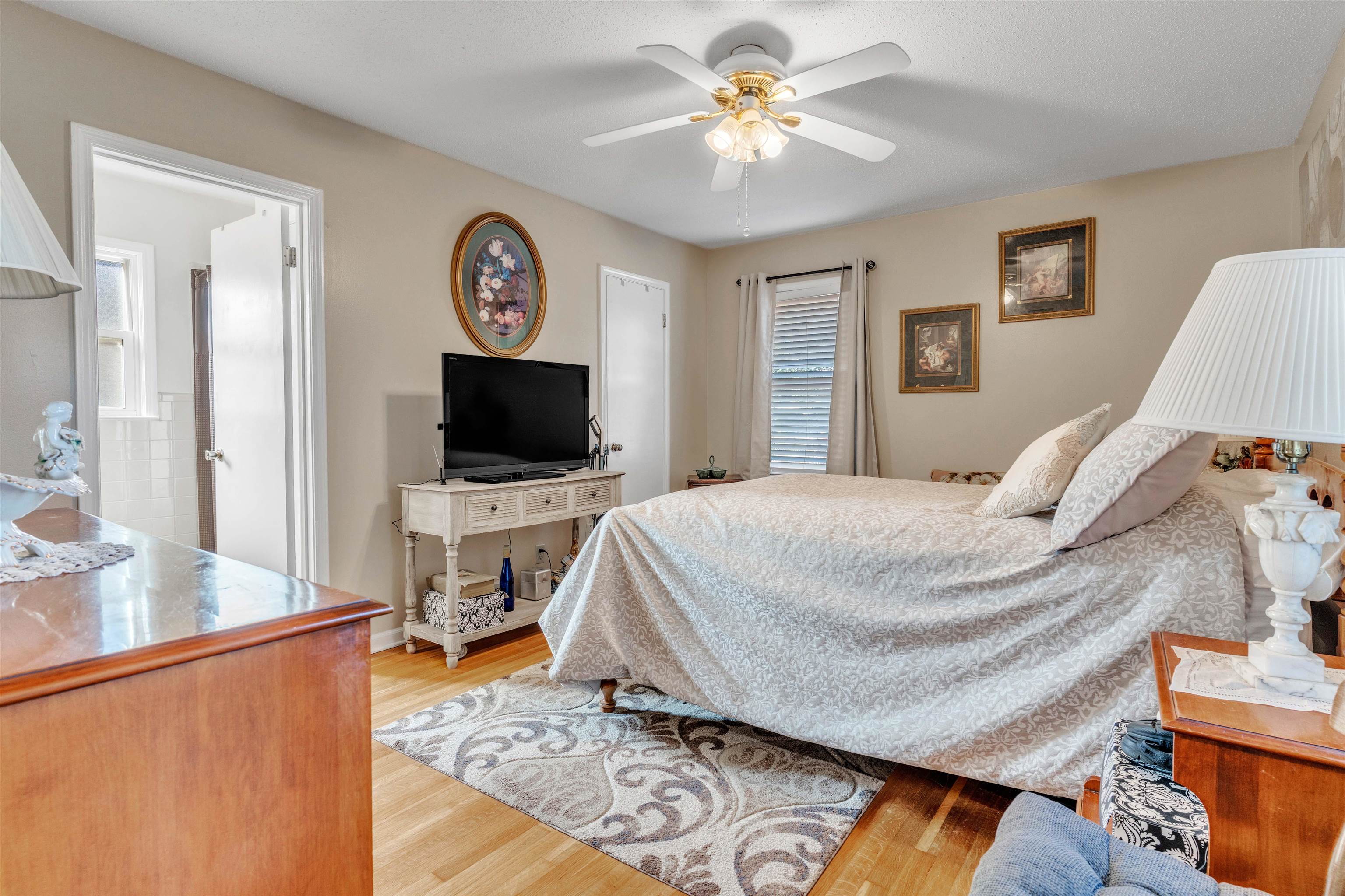 3613 Acacia Street Memphis, TN 38116 - Photo 18 of 33 a bedroom with a bed and a flat screen tv