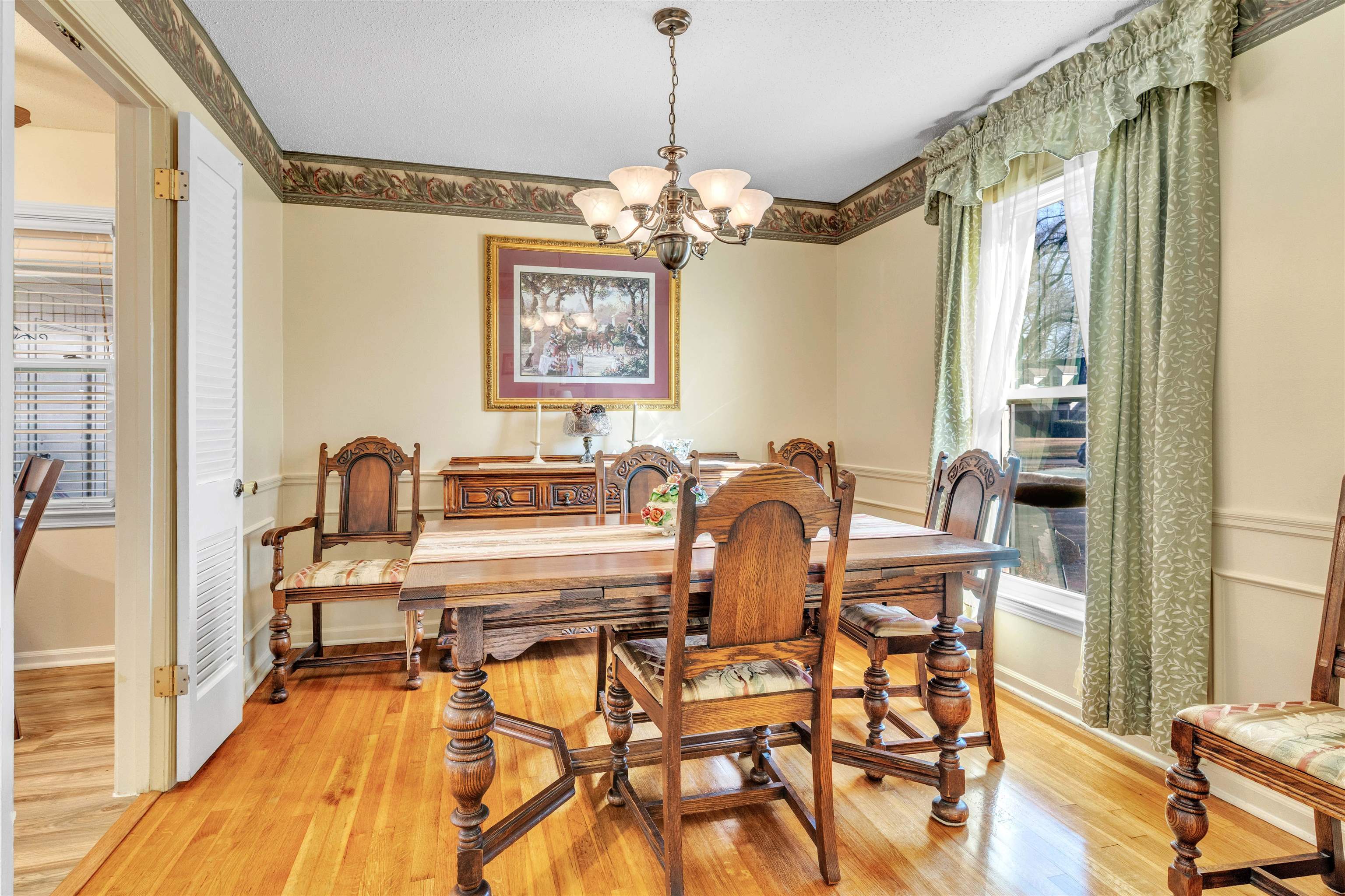 3613 Acacia Street Memphis, TN 38116 - Photo 21 of 33 a view of a dining room with furniture window and wooden floor