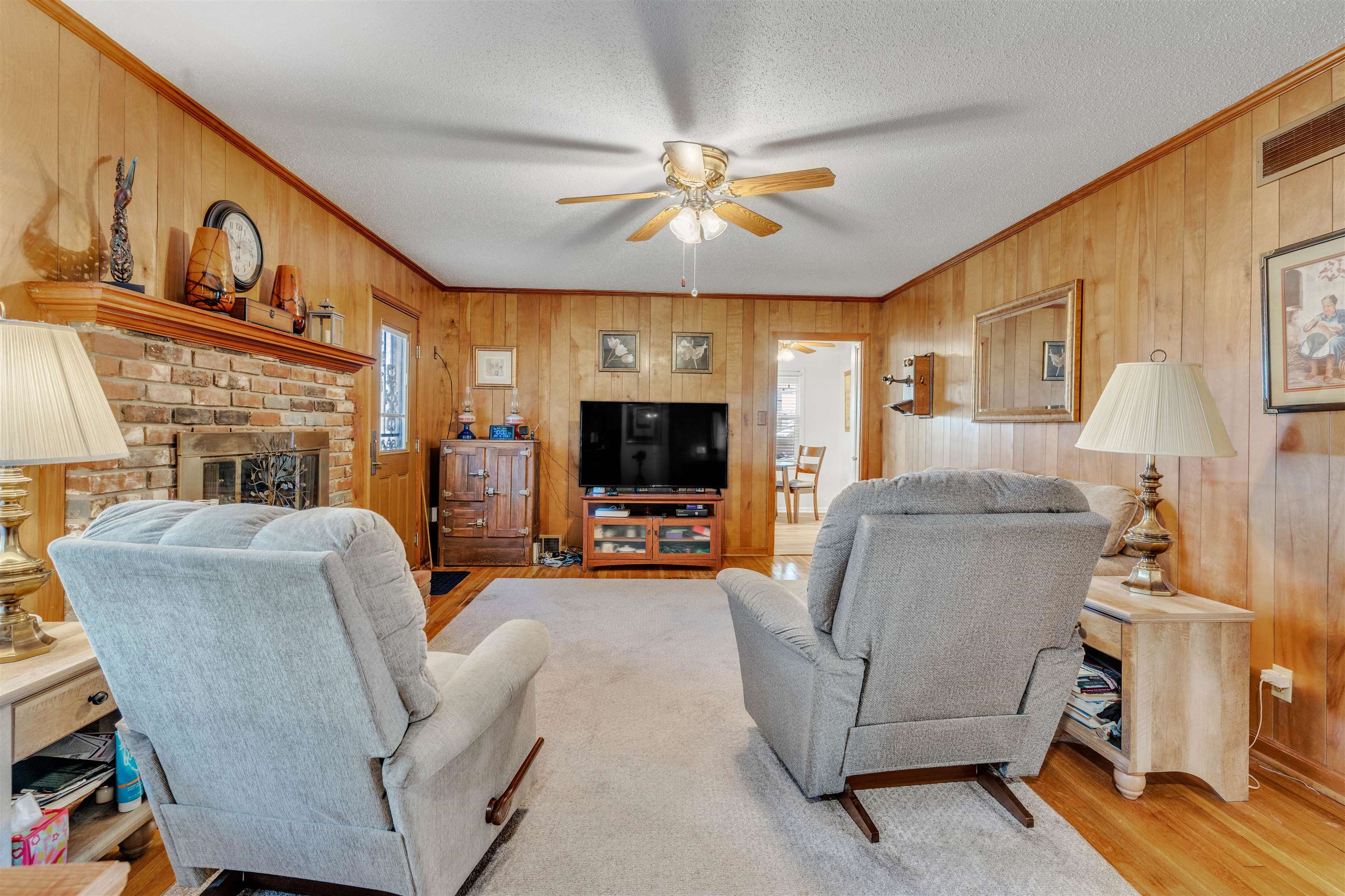 3613 Acacia Street Memphis, TN 38116 - Photo 6 of 33 a living room with furniture and a fireplace