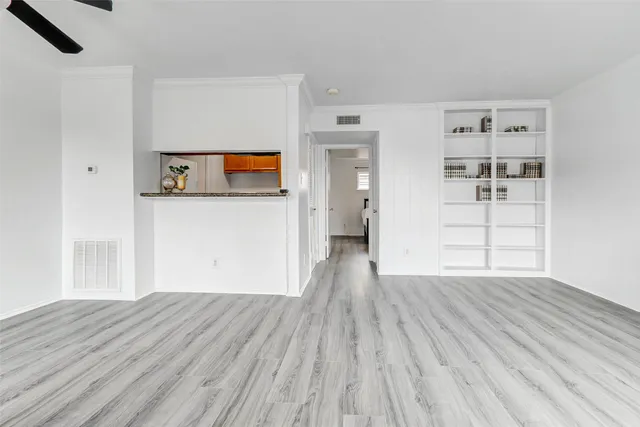 a view of a livingroom with wooden floor