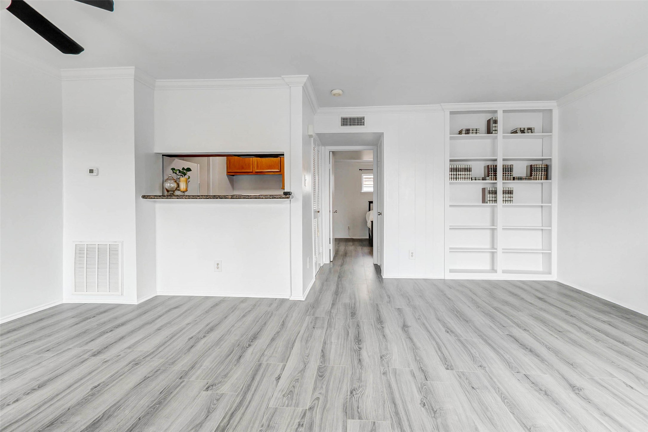 6402 Del Monte Drive, Unit 65 Houston, TX 77057 - Photo 13 of 21 a view of a livingroom with wooden floor