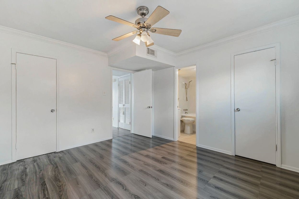 6402 Del Monte Drive, Unit 65 Houston, TX 77057 - Photo 14 of 21 a view of an empty room with wooden floor