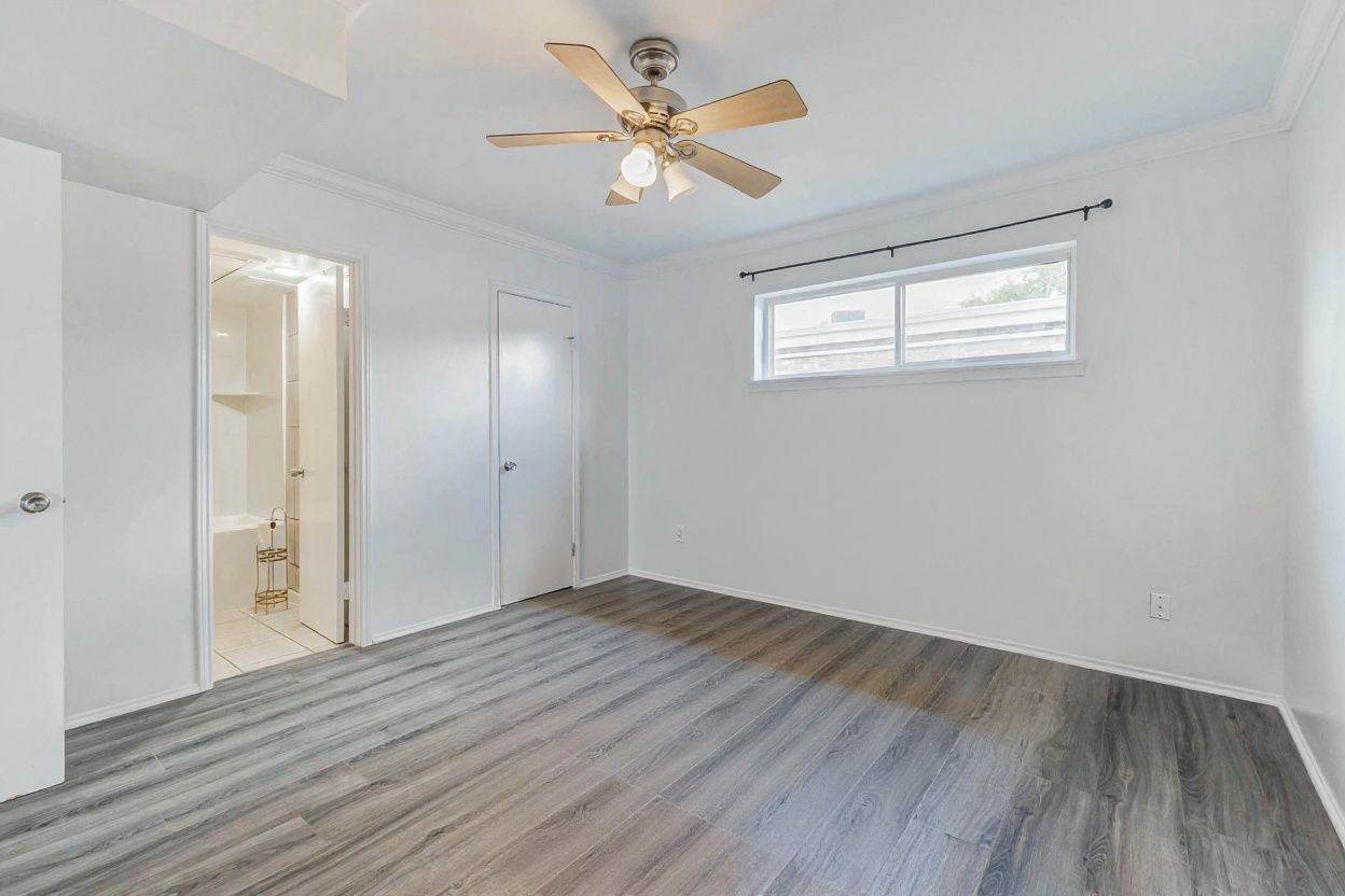 6402 Del Monte Drive, Unit 65 Houston, TX 77057 - Photo 16 of 21 a view of an empty room with wooden floor