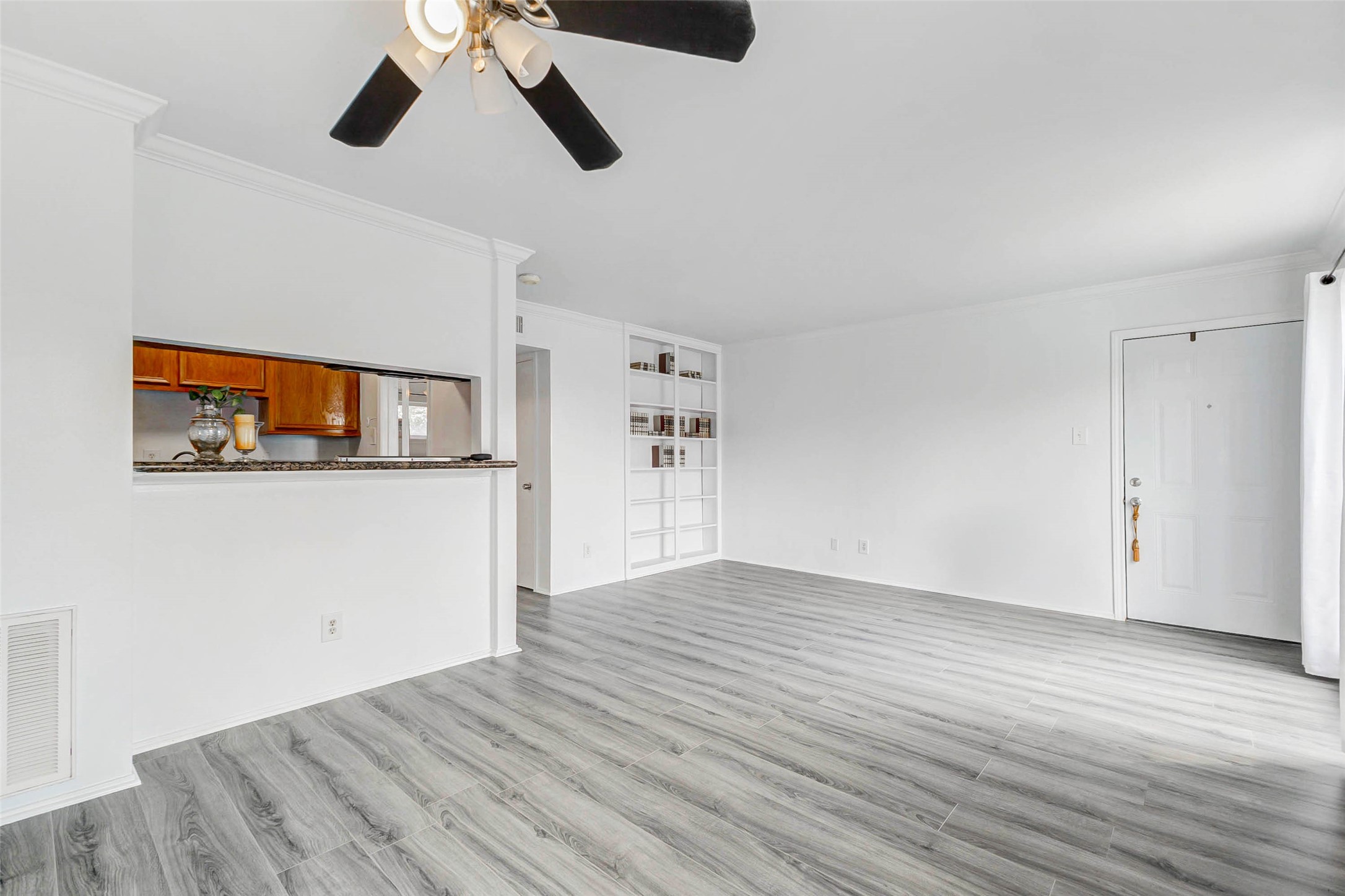 6402 Del Monte Drive, Unit 65 Houston, TX 77057 - Photo 7 of 21 a view of empty room with wooden floor
