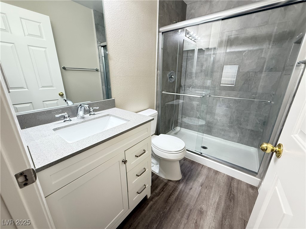 1624 Box Step Drive Henderson, NV 89014 - Photo 18 of 23 Bathroom featuring wood finished floors, a shower