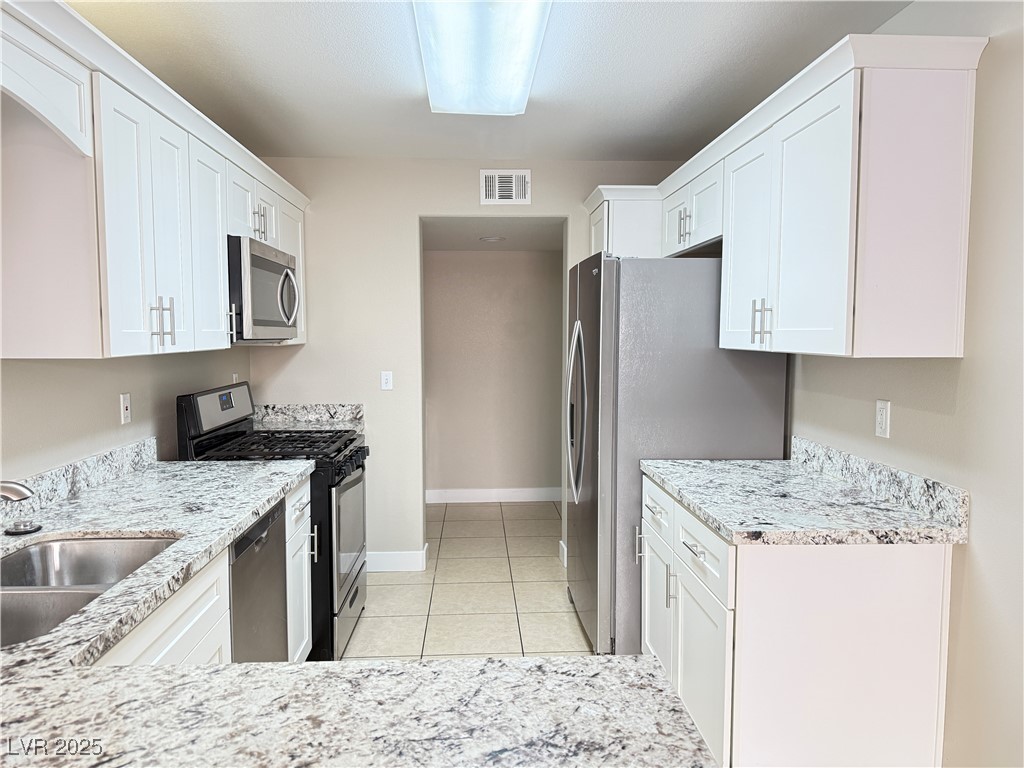 1624 Box Step Drive Henderson, NV 89014 - Photo 7 of 23 Kitchen featuring stainless steel appliances, a si