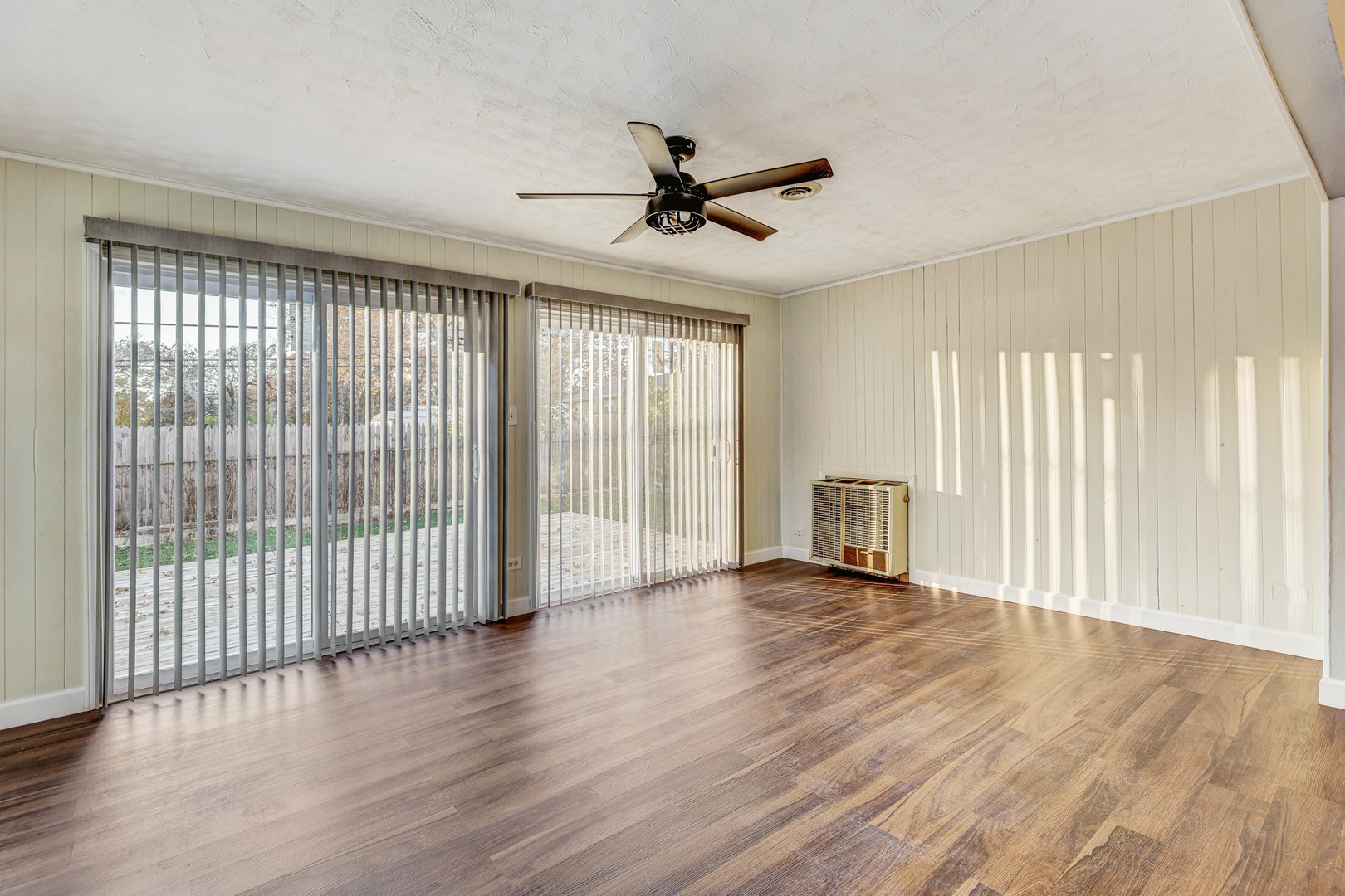 8 Timber Trail Streamwood, IL 60107 - Photo 11 of 27 wooden floor in an empty room with a window