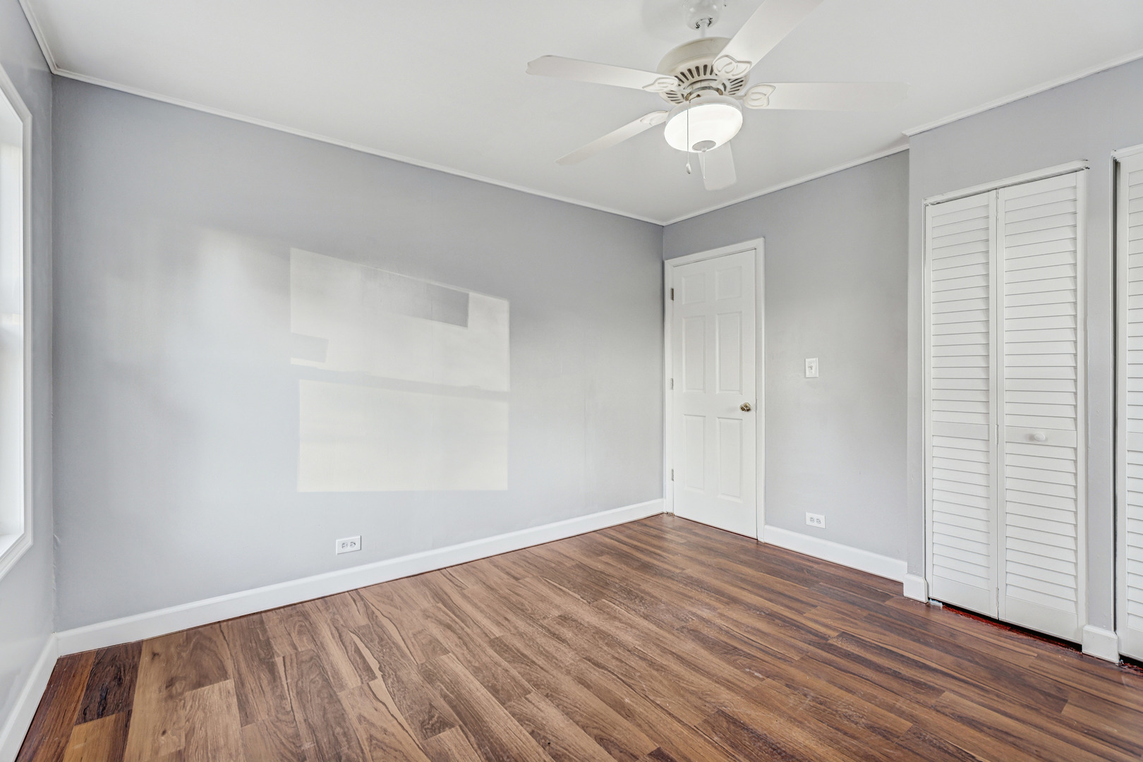 8 Timber Trail Streamwood, IL 60107 - Photo 16 of 27 wooden floor in an empty room with a window