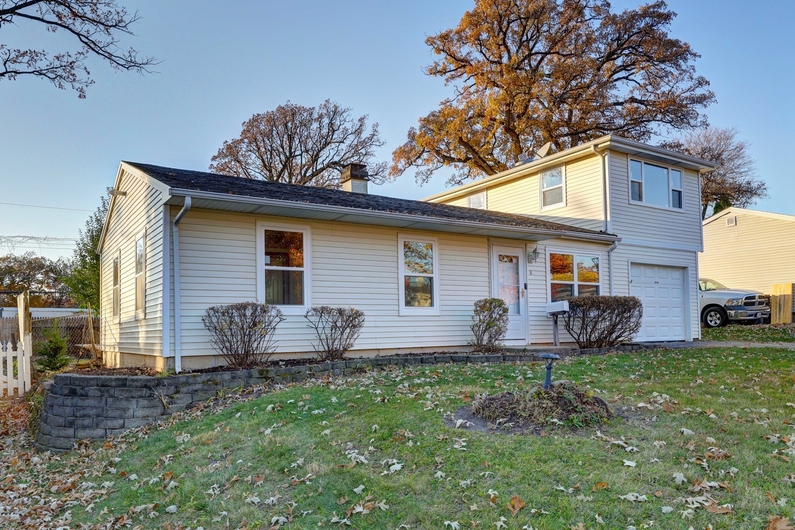8 Timber Trail Streamwood, IL 60107 - Photo 2 of 27 a front view of house with backyard and seating space
