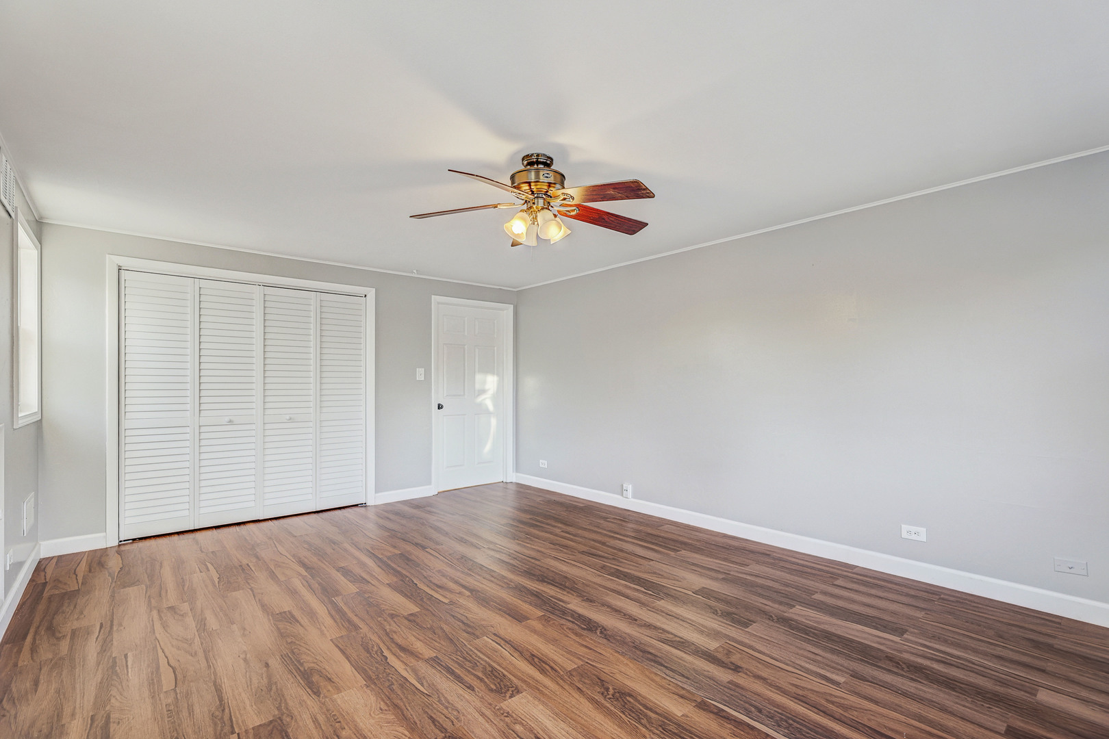 8 Timber Trail Streamwood, IL 60107 - Photo 23 of 27 a view of an empty room with wooden floor
