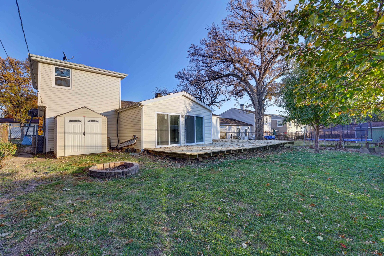 8 Timber Trail Streamwood, IL 60107 - Photo 25 of 27 a view of a house with a yard
