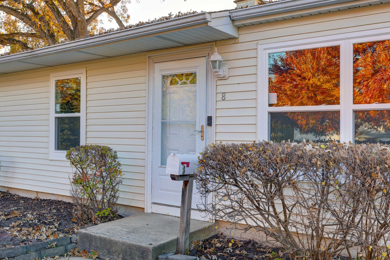 8 Timber Trail Streamwood, IL 60107 - Photo 4 of 27 a front view of a house with garden