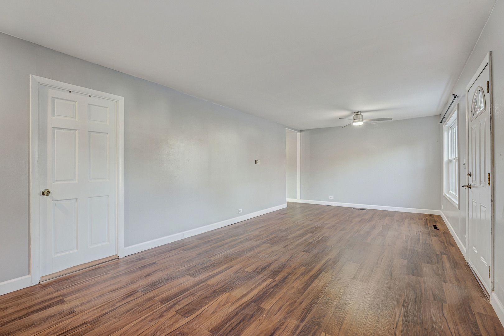 8 Timber Trail Streamwood, IL 60107 - Photo 6 of 27 a view of an empty room with wooden floor