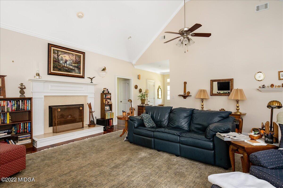 146 Lower Simmons Road Macon, GA 31220 - Photo 13 of 43 a living room with furniture and a fireplace