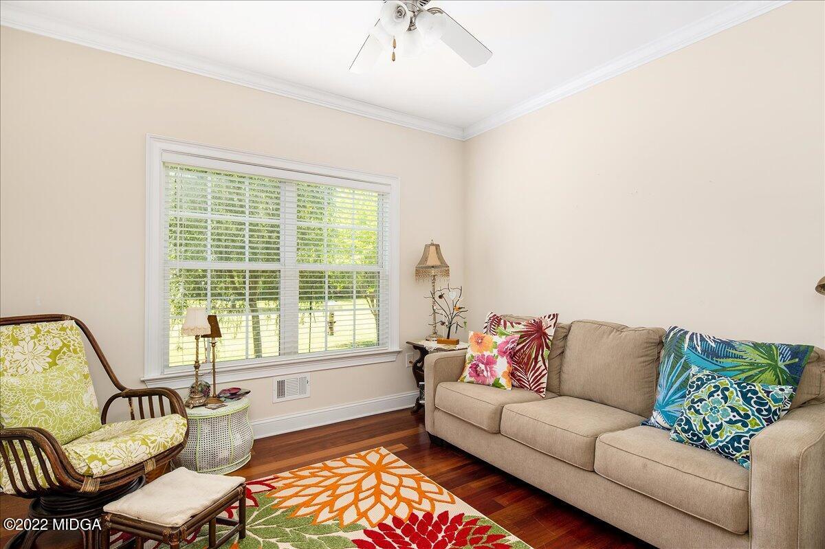 146 Lower Simmons Road Macon, GA 31220 - Photo 14 of 43 a living room with furniture and a large window
