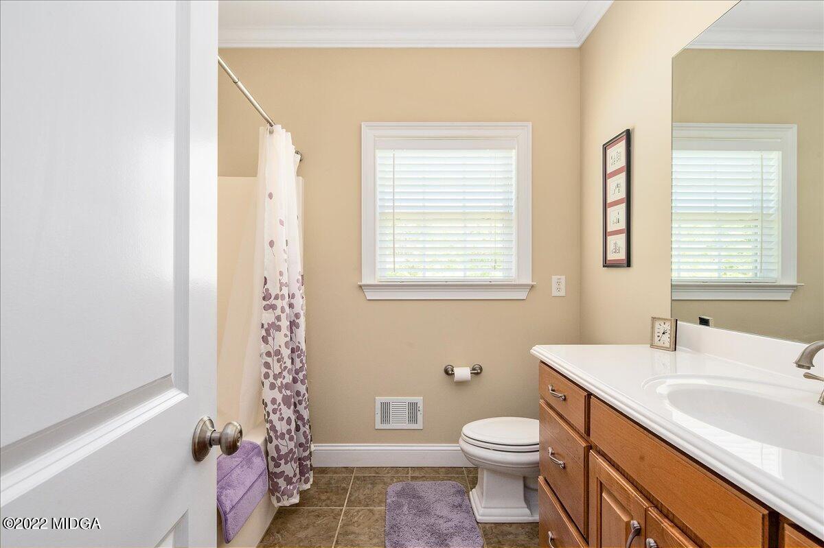 146 Lower Simmons Road Macon, GA 31220 - Photo 16 of 43 a bathroom with a sink a toilet and shower