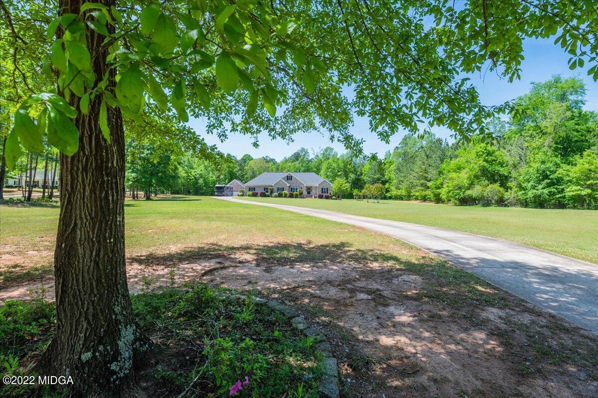 146 Lower Simmons Road Macon, GA 31220 - Photo 2 of 43 a view of a yard with an outdoor space
