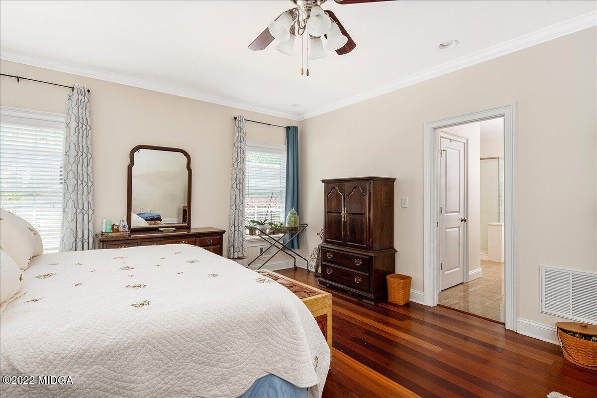 146 Lower Simmons Road Macon, GA 31220 - Photo 24 of 43 a bedroom with a bed and a flat screen tv