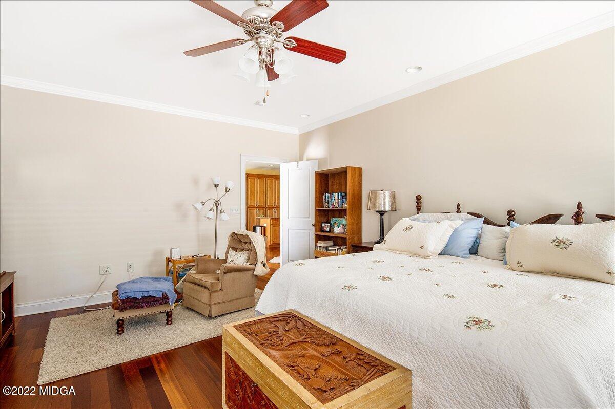 146 Lower Simmons Road Macon, GA 31220 - Photo 25 of 43 a bedroom with a bed and a chandelier