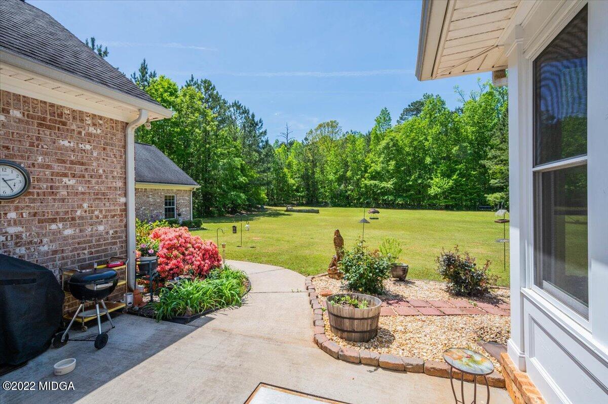 146 Lower Simmons Road Macon, GA 31220 - Photo 32 of 43 a front view of a house with patio