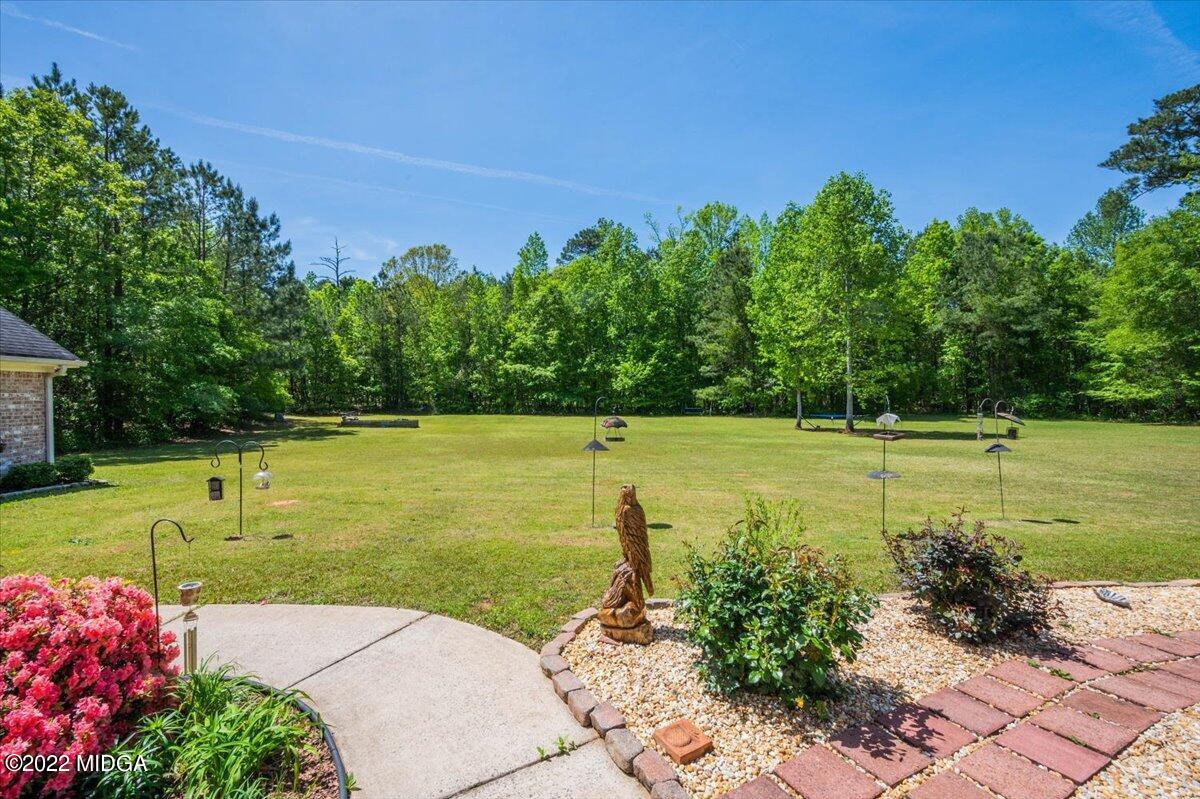 146 Lower Simmons Road Macon, GA 31220 - Photo 33 of 43 a view of a swimming pool with a yard