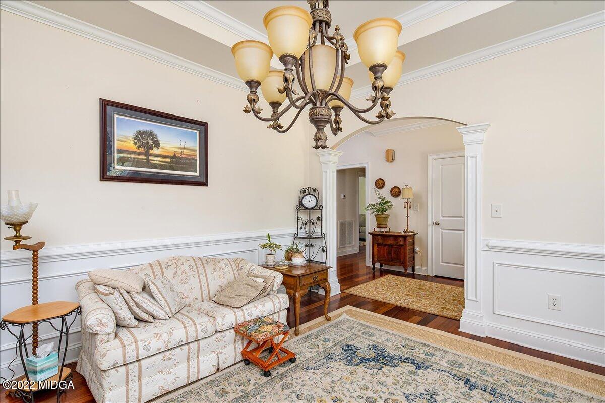 146 Lower Simmons Road Macon, GA 31220 - Photo 9 of 43 a view of a livingroom with furniture and a chandelier