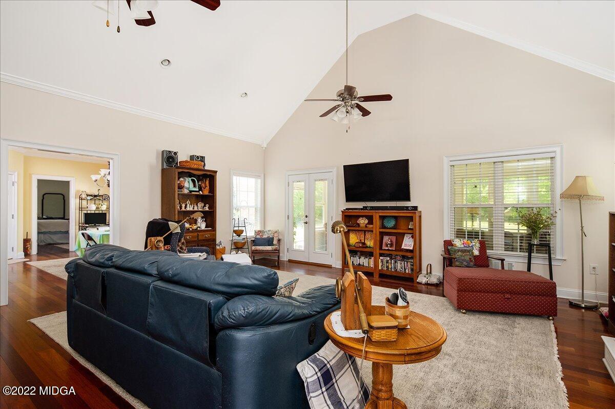 146 Lower Simmons Road Macon, GA 31220 - Photo 10 of 43 a living room with furniture a flat screen tv and a large window