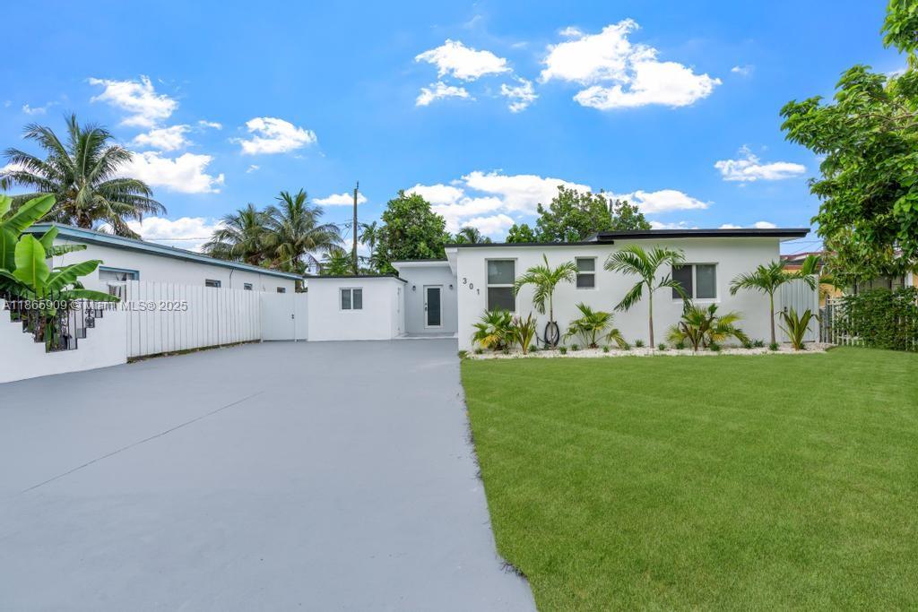 a view of a house with a big yard
