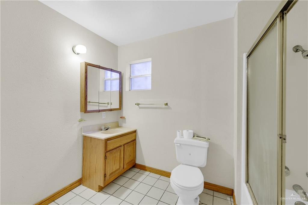 18 Bellas Lane Rio Grande City, TX 78582 - Photo 14 of 28 a bathroom with a toilet sink and mirror
