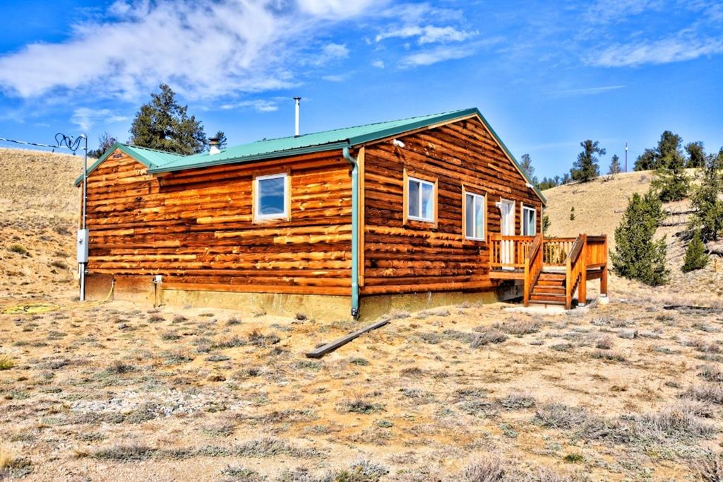 631 Murphy Road Como, CO 80432 - Photo 1 of 21 a backyard of a house