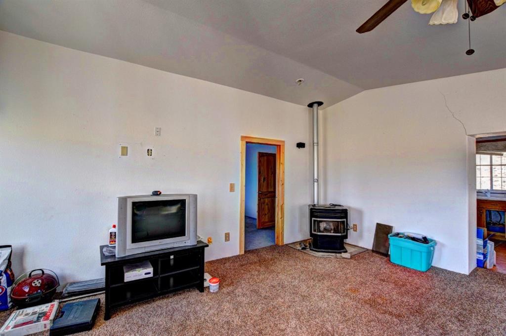631 Murphy Road Como, CO 80432 - Photo 11 of 21 a living room with furniture and a flat screen tv