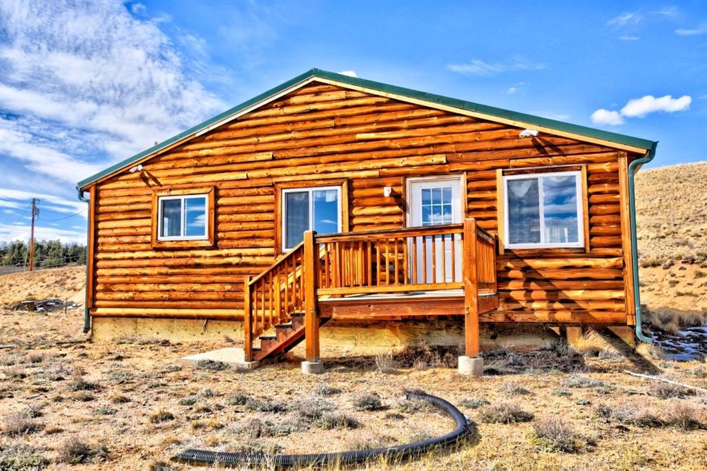 631 Murphy Road Como, CO 80432 - Photo 12 of 21 a view of a house with wooden fence