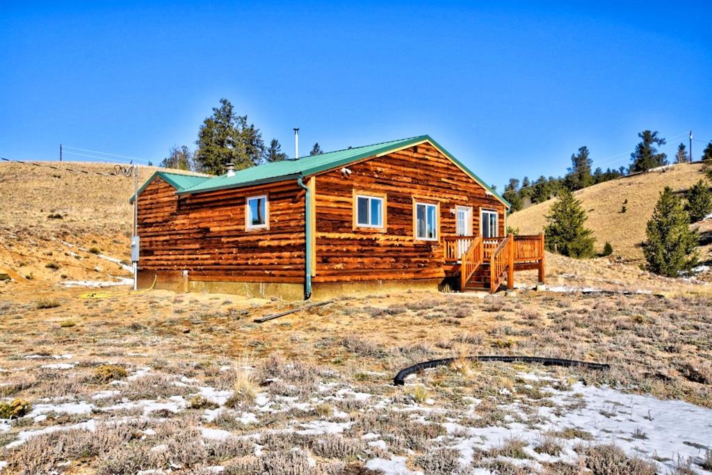 631 Murphy Road Como, CO 80432 - Photo 17 of 21 a view of a house with a snow in the background