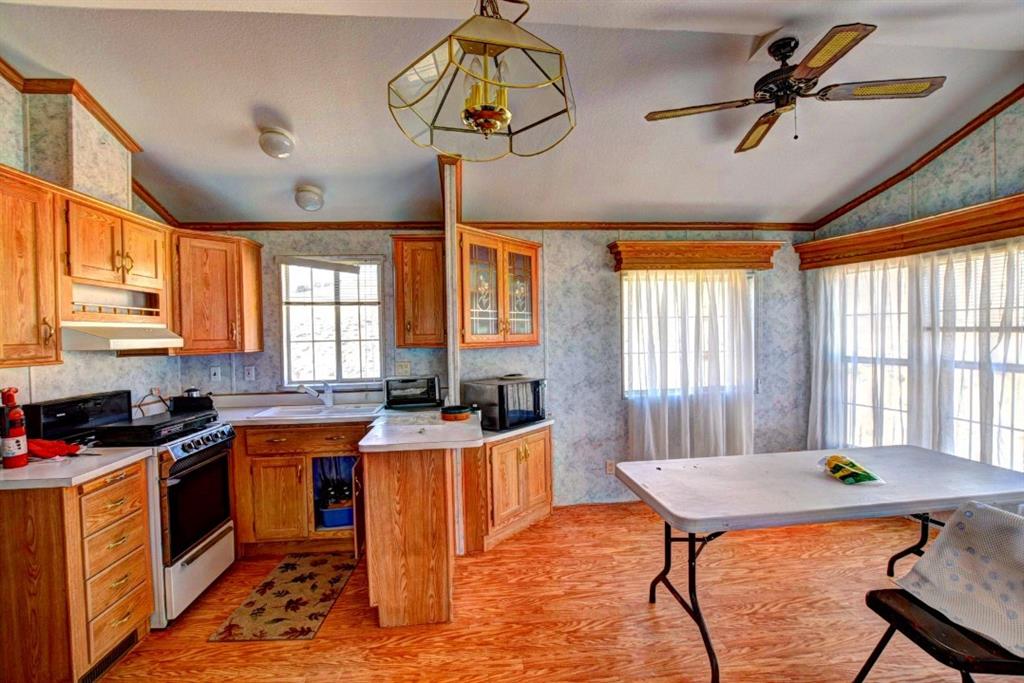 631 Murphy Road Como, CO 80432 - Photo 4 of 21 a kitchen with stainless steel appliances granite countertop a sink a stove and a refrigerator