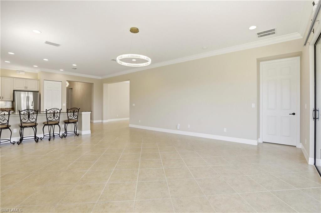11505 Summerview Way Fort Myers, FL 33913 - Photo 14 of 50 an empty room with white walls and chairs