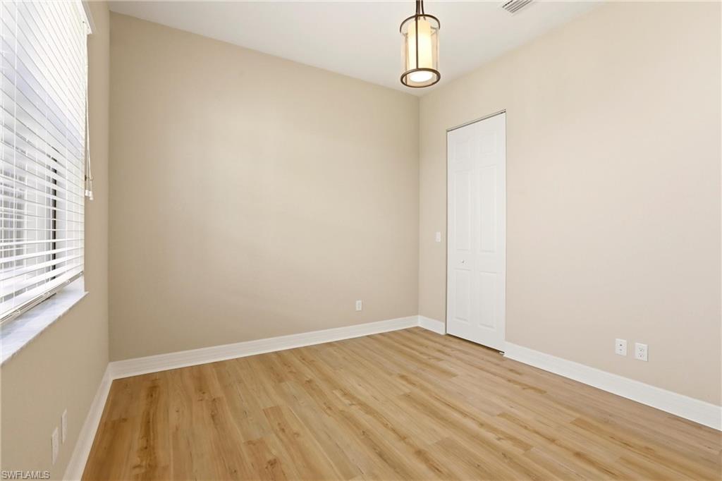 11505 Summerview Way Fort Myers, FL 33913 - Photo 23 of 50 a view of a room with wooden floor and windows
